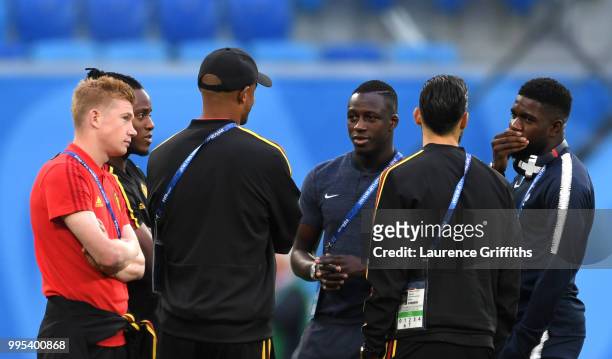 Benjamin Mendy of France and Samuel Umtiti of France speak to Belgium players during a pitch inspection prior to the 2018 FIFA World Cup Russia Semi...