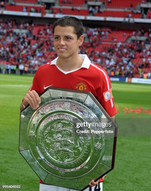 Javier Hernandez of Manchester United celebrates with the trophy after the FA Community Shield between Chelsea and Manchester United at Wembley...