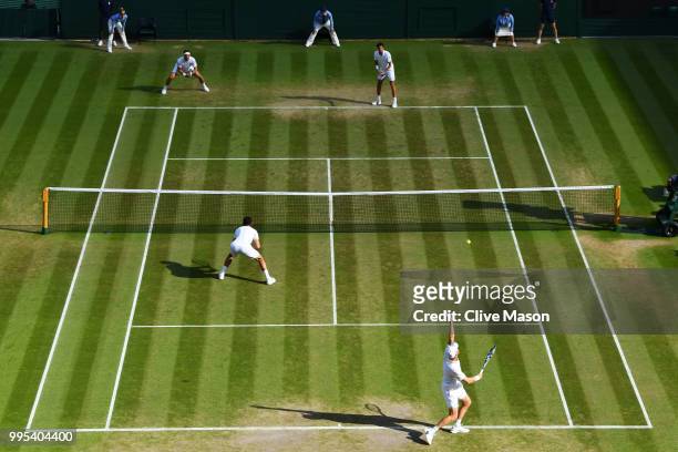 Robin Haase of the Netherlands and Robert Lindstedt of Sweden compete against Dominic Inglot of Great Britain and Franko Skugor of Croatia during...