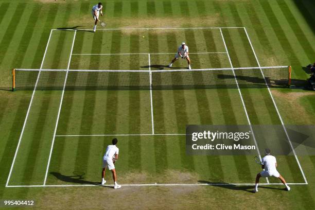 Robin Haase of the Netherlands and Robert Lindstedt of Sweden compete against Dominic Inglot of Great Britain and Franko Skugor of Croatia during...