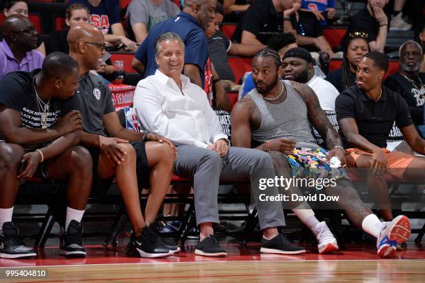 Assistant Coach Sam Cassell of the LA Clippers and John Wall of the the Washington Wizards enjoy the game between the the Cleveland Cavaliers and the...