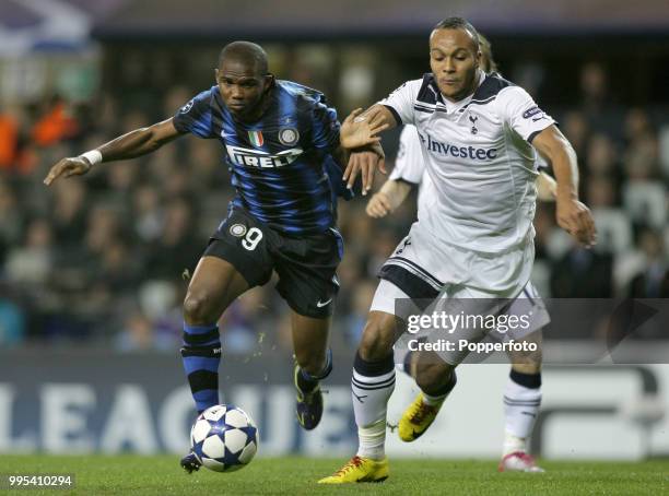 Samuel Eto'o of Inter Milan battles with Younes Kaboul of Tottenham during an UEFA Champions League group match at White Hart Lane on November 2,...