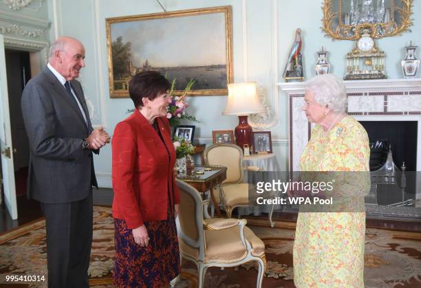 Queen Elizabeth II greets the Governor General of New Zealand Dame Patsy Reddy, with her husband David Gascoigne during a private audience at...