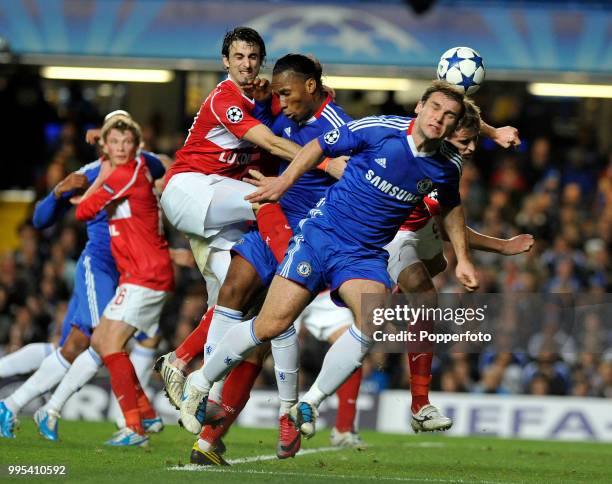 Didier Drogba and Branislav Ivanovic of Chelsea take on Nicolas Pareja and Dimitri Kombarov of Spartak Moscow during an UEFA Champions League group...