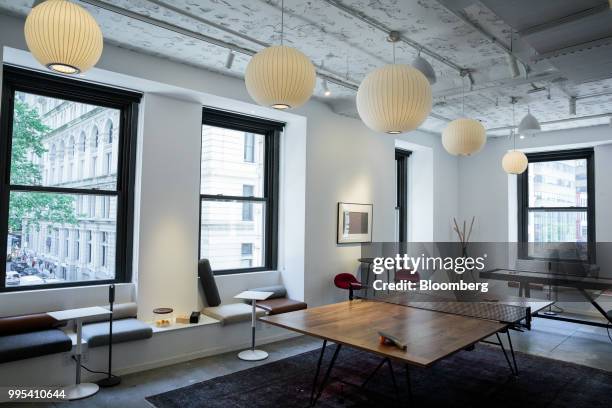 Ping pong table stands in a game room at the Convene workspace flagship location in New York, U.S., on Monday, July 2, 2018. Convene, a New...