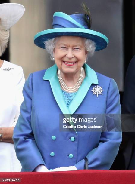 Queen Elizabeth II watches the RAF flypast on the balcony of Buckingham Palace, as members of the Royal Family attend events to mark the centenary of...