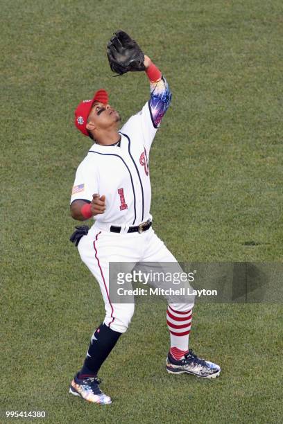 Wilmer Difo of the Washington Nationals prepares to catch a fly ball during a baseball game against the Boston Red Sox at Nationals Park on July 2,...