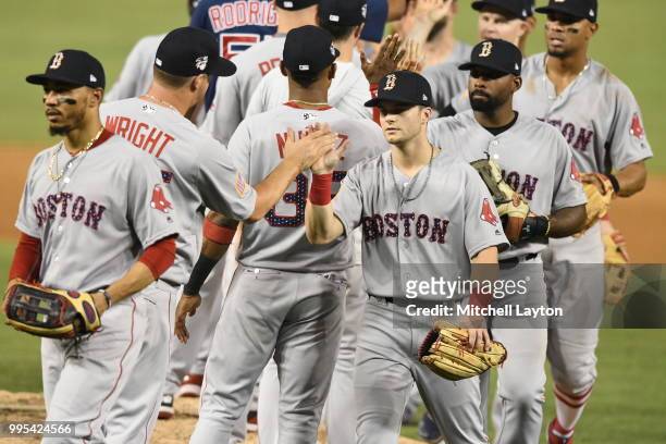 Andrew Benintendi of the Boston Red Sox celebrates a win after a baseball game against the Washington Nationals at Nationals Park on July 2, 2018 in...