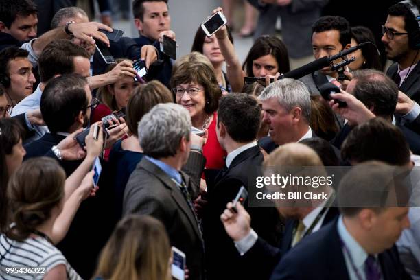 Reporters swarm Sen. Susan Collins, R-Maine, as she arrives for the Senate Republicans' policy lunch in the Capitol on Tuesday, July 10 the day after...