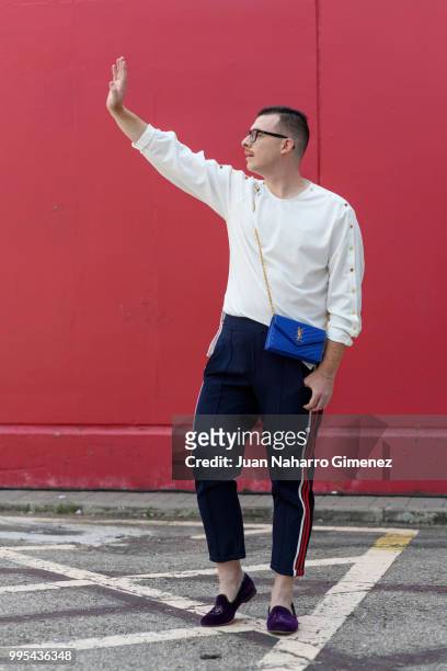 Demetrio de la Torre wears Slippers Bow Tie shoes, ZARA trousers, @numero8spain shirt Yves Saint laurent handbag and Lord Wilmore glasses during the...