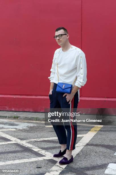 Demetrio de la Torre wears Slippers Bow Tie shoes, ZARA trousers, @numero8spain shirt Yves Saint laurent handbag and Lord Wilmore glasses during the...