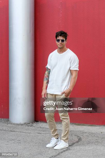 Diego Matamoros wears Dolce & Gabbana trainers, ZARA trousers and shirt and Fendi sunnglasses during the Mercedes Benz Fashion Week Spring/Summer...