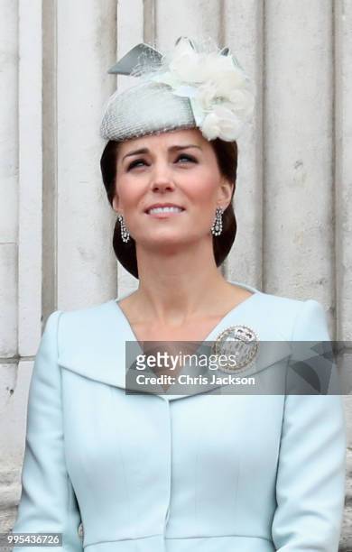 Catherine, Duchess of Cambridge watches the RAF flypast on the balcony of Buckingham Palace, as members of the Royal Family attend events to mark the...