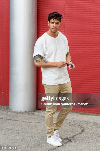 Diego Matamoros wears Dolce & Gabbana trainers, ZARA trousers and shirt and Fendi sunnglasses during the Mercedes Benz Fashion Week Spring/Summer...