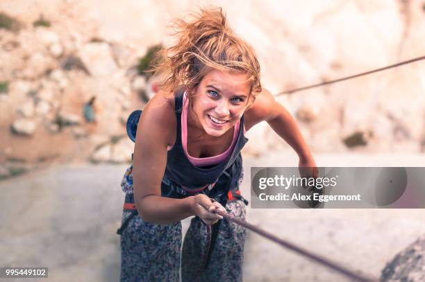 rock climber rock climbing, yosemite national park, united states - rock climbing stock-fotos und bilder