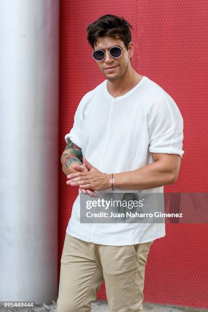 Diego Matamoros wears Dolce & Gabbana trainers, ZARA trousers and shirt and Fendi sunnglasses during the Mercedes Benz Fashion Week Spring/Summer...