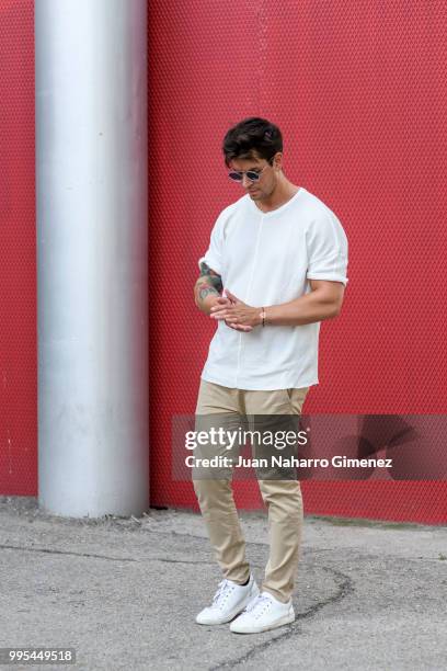 Diego Matamoros wears Dolce & Gabbana trainers, ZARA trousers and shirt and Fendi sunnglasses during the Mercedes Benz Fashion Week Spring/Summer...