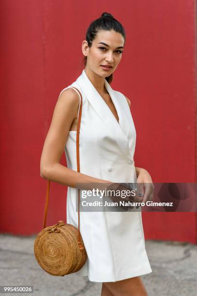 Estela Grande wears Yves Saint Laurent shoes, Zara dress and Gota de Agua handbag during the Mercedes Benz Fashion Week Spring/Summer 2019 at IFEMA...