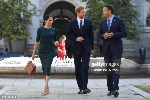 Meghan, Duchess of Sussex and Prince Harry, Duke of Sussex are greeted by the Taoiseach of Ireland Leo Varadkar, as they arrive at the start of a...