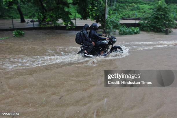 Water logging on Ghodbunder road near Chena Village on July 9, 2018 in Thane, India. Indias financial capital and its surrounding districts were in...