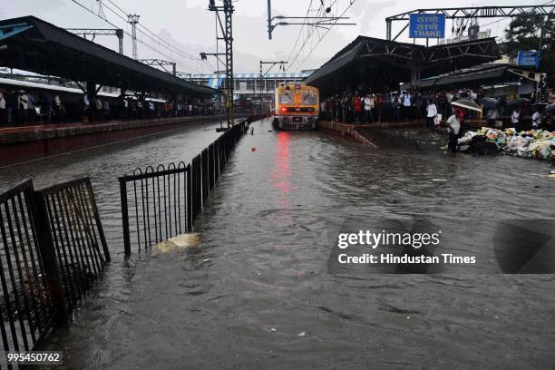 Water logging on tracks at Thane railway station on July 9, 2018 in Thane, India. Indias financial capital and its surrounding districts were in for...