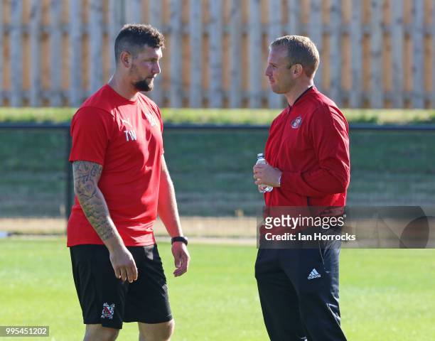 Darlington manager Tommy Wright talks with Sunderland player Lee Cattermole prior a pre-season friendly game between Darlington FC and Sunderland AFC...