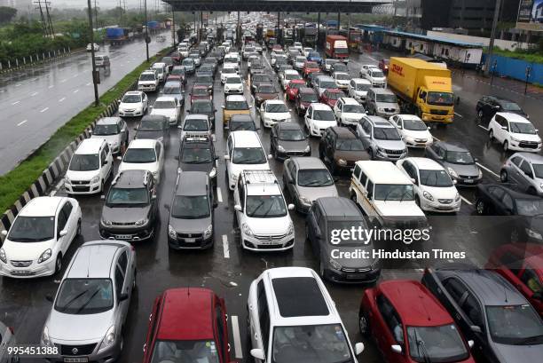 Traffic Jam on Sion-Panvel highway at near Kharghar Toll-Plaza after heavy rainfall on July 9, 2018 in Navi Mumbai, India. Indias financial capital...