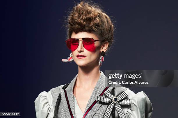 Model walks the runway during the Ana Locking show at Mercedes Benz Fashion Week Madrid Spring/Summer 2019 on July 10, 2018 in Madrid, Spain.