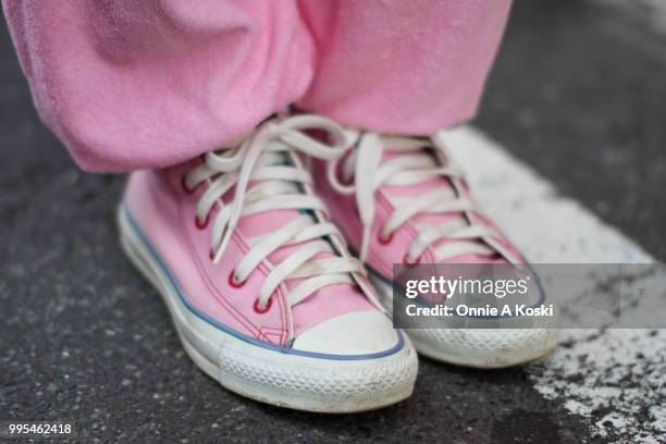 Rion, an 18-year-old high school student, stops for a fashion snap on July 08, 2018 in Tokyo, Japan. Rion is wearing second-hand vintage clothes,...