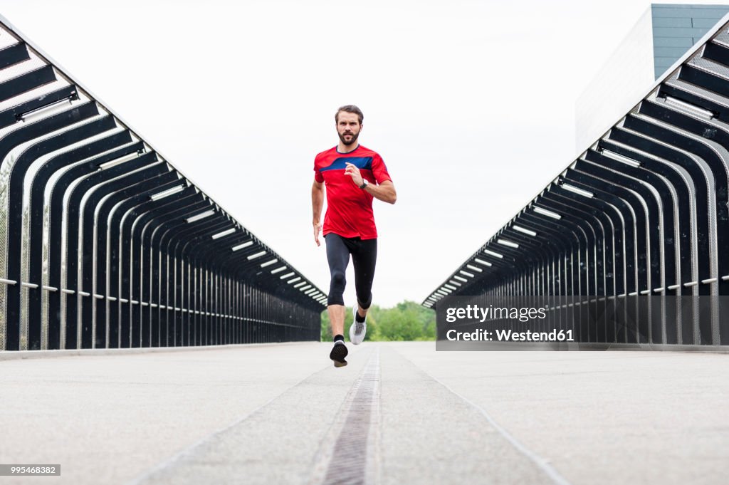 Man running on a bridge