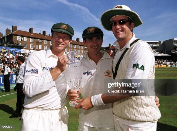 Australian captain Steve Waugh, Justin Langer and Mark Waugh all hold the Ashes trophy after winning the 5th Ashes Test between England and Australia...