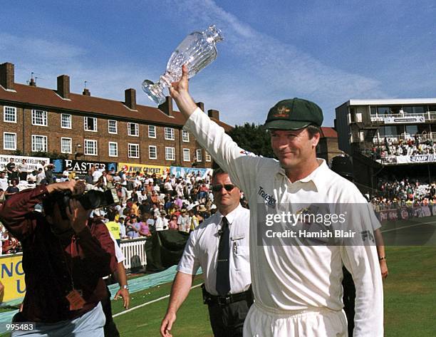 Australian captain Steve Waughholds a loft the Ashes trophy after winning the 5th Ashes Test between England and Australia at The AMP Oval, London....