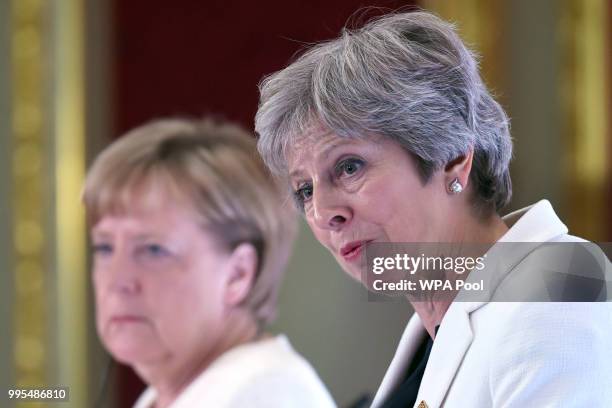 German chancellor Angela Merkel and Prime Minister Theresa May are seen during a press conference with Polish Prime Minister Mateusz Morawiecki...