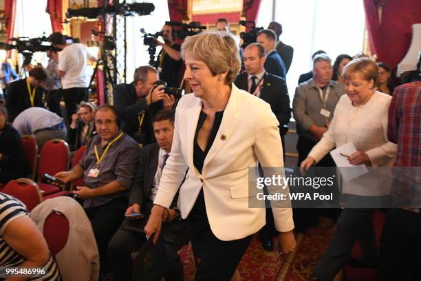 German chancellor Angela Merkel and Prime Minister Theresa May arrive for a press conference with Polish Prime Minister Mateusz Morawiecki during the...