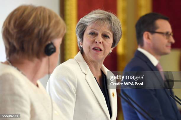 German chancellor Angela Merkel, Prime Minister Theresa May and Polish Prime Minister Mateusz Morawiecki attend a press conference during the second...