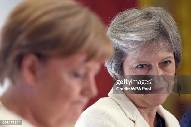 German chancellor Angela Merkel and Prime Minister Theresa May are seen during a press conference with Polish Prime Minister Mateusz Morawiecki...