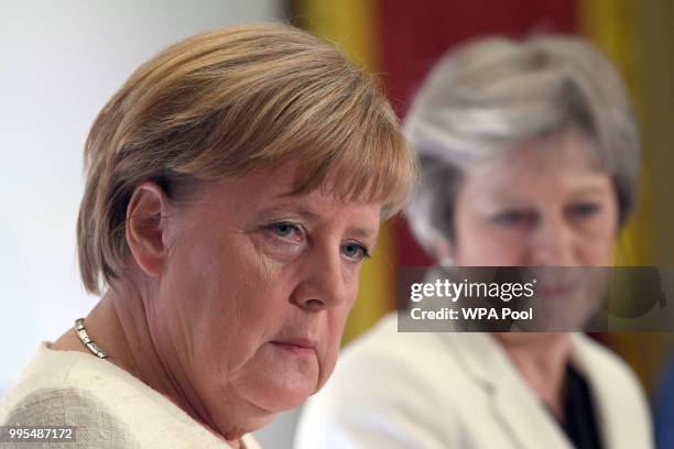 German chancellor Angela Merkel and Prime Minister Theresa May are seen during a press conference with Polish Prime Minister Mateusz Morawiecki...