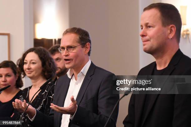 Senator of Economics Ramona Pop , Berlin's mayor Michael Mueller and Senator of Culture Klaus Lederer give a statement at the Red City Hall after the...