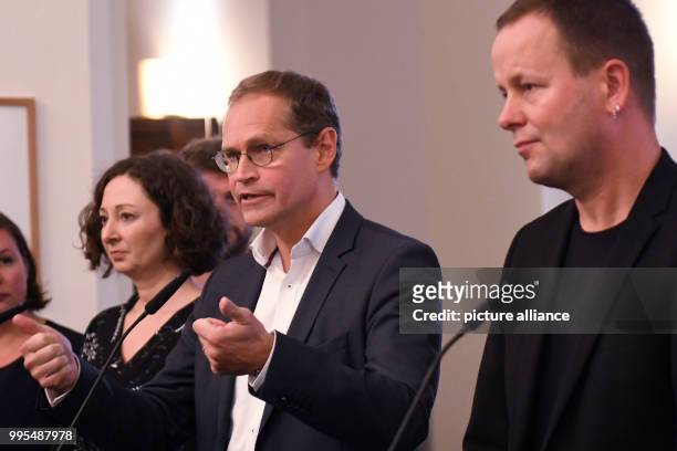 Senator of Economics Ramona Pop , Berlin's mayor Michael Mueller and Senator of Culture Klaus Lederer give a statement at the Red City Hall after the...