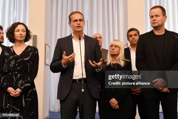 Senator of Economics Ramona Pop , Berlin's mayor Michael Mueller and Senator of Culture Klaus Lederer give a statement at the Red City Hall after the...