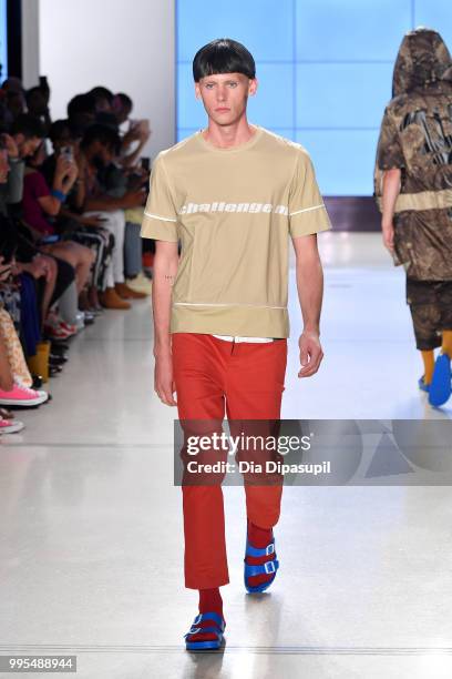 Model walks the runway for Wood House Army during July 2018 New York City Men's Fashion Week at Cadillac House on July 10, 2018 in New York City.