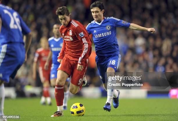 Fernando Torres of Liverpool is challenged by Yury Zhirkov Chelsea during a Barclays Premier League match at Anfield on November 7, 2010 in...