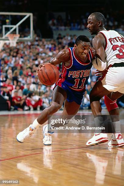 Isiah Thomas of the Detroit Pistons drives against Terry Porter of the Portland Trail Blazers during Game Five of the 1990 NBA Finals on June 14,...