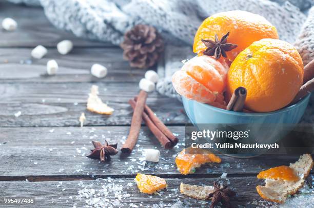 tangerine in scarf over wooden background - tangerine 2015 film stock-fotos und bilder