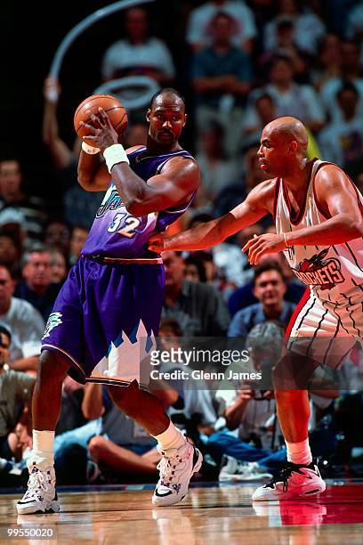 Karl Malone of the Utah Jazz looks to make a move against Charles Barkley of the Houston Rockets in Game Four of the Western Conference Finals during...
