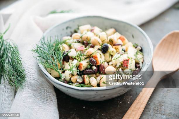 bean salad, with black beans, chickpea, apple, spring onion and dill - chick pea salad stock pictures, royalty-free photos & images
