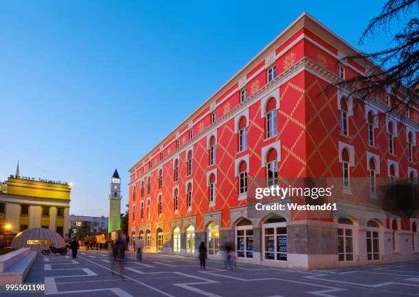 albania, tirana, clock tower and minstry of urban development, blue hour - albania fotografías e imágenes de stock