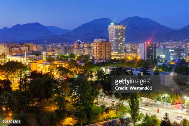 albania, tirana, city center and tid tower in the evening - tid fotografías e imágenes de stock