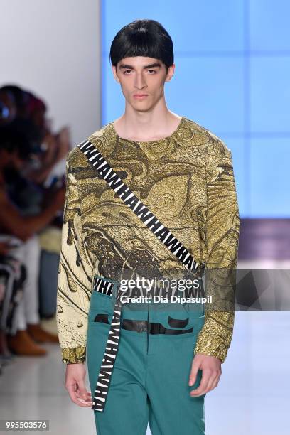 Model walks the runway for Wood House Army during July 2018 New York City Men's Fashion Week at Cadillac House on July 10, 2018 in New York City.