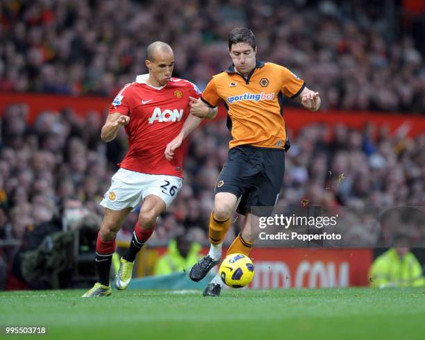 Stephen Ward of Wolverhampton Wanderers holds off Gabriel Obertan of Manchester United during a Barclays Premier League match at Old Trafford on...